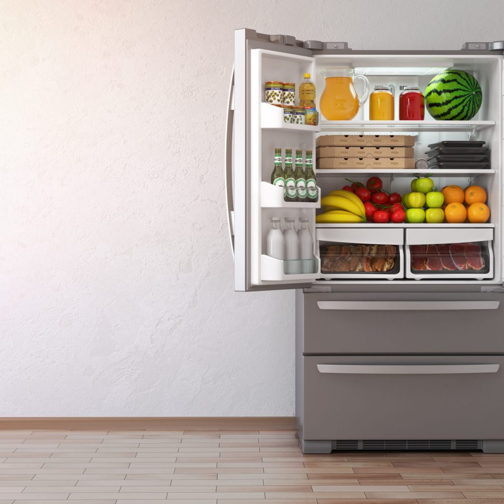 Modern refrigerator in a kitchen, perfect for illustrating refrigerator repair tips to fix a leaking fridge.