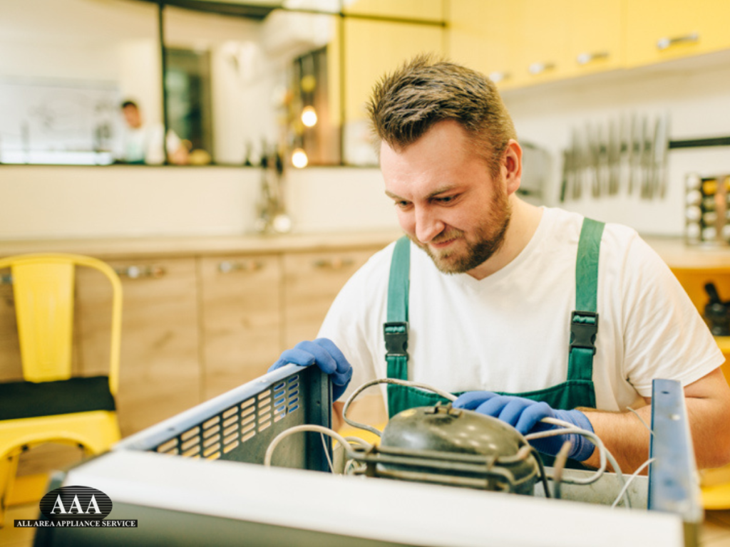 Technician performing same day appliance repair on a malfunctioning home refrigerator in a modern kitchen to quickly restore cooling and prevent food spoilage.